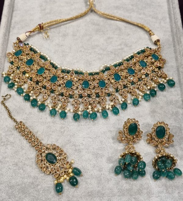 green crystal set with earrings and tikka