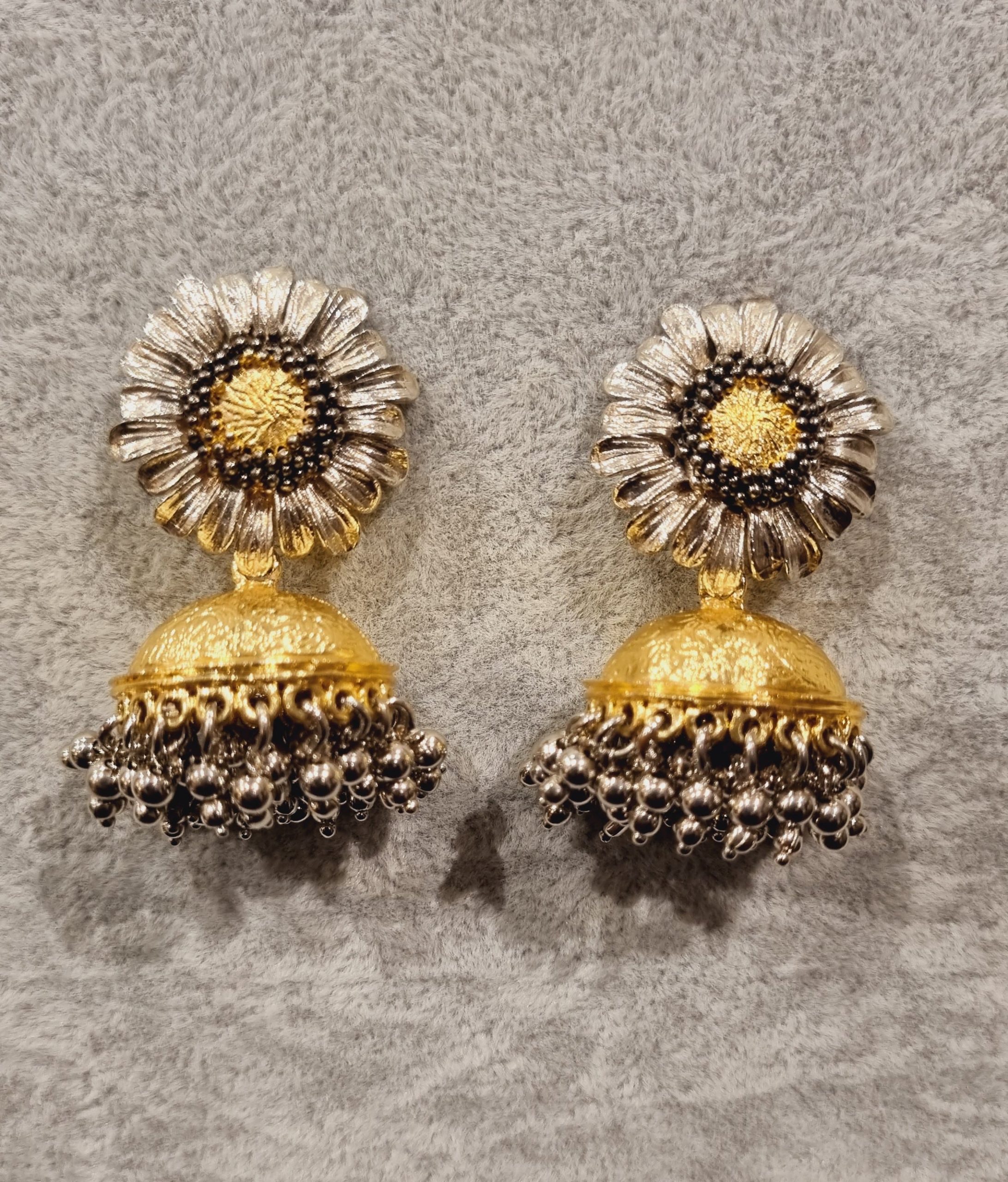 silver petal and gold jhumki earrings